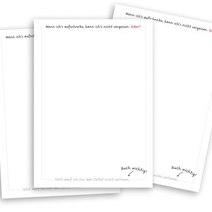May include: Three blank white note cards with black text that reads "Wenn ich's aufschreibe, kann ich's nicht vergessen. Oder?" and "Auch wichtig!" with an arrow pointing to the text. The text on the bottom of the cards reads "Jetzt darf ich nur den Zettel nicht verlieren..."