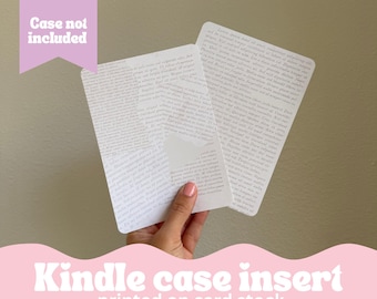 May include: Two white cardstock inserts for a Kindle case, printed with a dense, black and white text pattern. The text is in a cursive font. The text is not legible. The text is printed on both sides of the inserts. The inserts are held in a hand. The text at the bottom of the image reads "Kindle case insert printed on card stock".