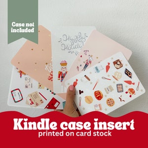 May include: Kindle case inserts printed on card stock, featuring festive designs. The inserts include illustrations of a nutcracker, baking tools, and holiday greetings. The text "Happy Holiday" and "To Santa" are visible.