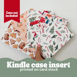 May include: Kindle case inserts with festive Christmas patterns. Designs include gingerbread houses, trees, candy canes, and a red truck. The text "Merry" is visible on the inserts. The inserts are printed on card stock.