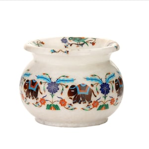 May include: White marble planter with a decorative design of elephants, flowers, and birds in shades of blue, green, orange, and brown.
