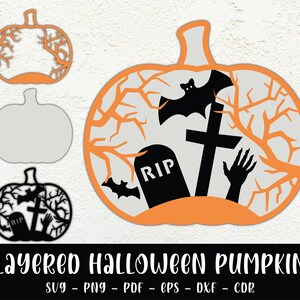 May include: Layered Halloween pumpkin design with a black silhouette of a pumpkin, a tombstone, a cross, a bat, and a hand reaching out. The pumpkin is orange with a white background.