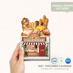 May include: A 2027 stackable calendar featuring a bakery theme. The calendar has a red and white striped awning, a brick facade, and a variety of baked goods. The text "EST. CALENDAR 2027" is displayed above the bakery. The words "ANNUAL UPDATE INCLUDED" are also visible.