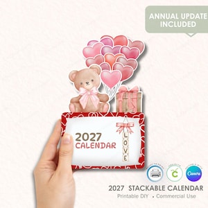 May include: A 2027 stackable calendar design featuring a teddy bear, heart-shaped balloons, and a gift box. The calendar has a red border and the word "LOVE" spelled out. The text "2027 CALENDAR" is displayed. The design includes the text "ANNUAL UPDATE INCLUDED".