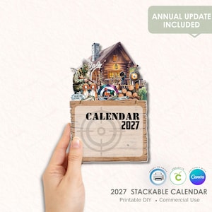 Puede incluir: Calendario 2027 con temática de caza. Presenta una cabaña de madera, un cazador, perros de caza y el texto "CALENDAR 2027". También son visibles las palabras "ANNUAL UPDATE INCLUDED".