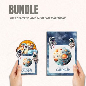 May include: A bundle of 2027 stacked and notepad calendars. The calendars feature a solar system theme with planets, astronauts, and the text "SOLAR SYSTEM 2027 CALENDAR". The color palette includes blue, orange, and white.