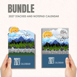 以下が含まれることがあります： 2027年のスタックカレンダーとメモ帳カレンダーのセット。それぞれ、笑顔の太陽、雲、青い山々、緑の森、街並みが描かれた風景イラストが特徴です。下部には「2027 CALENDAR」という文字が印刷されています。