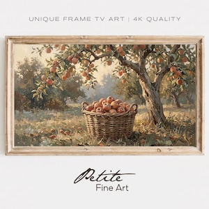 Puede incluir: Una impresión de arte digital enmarcada rectangular con el texto UNIQUE FRAME TV ART | 4K QUALITY y Petite Fine Art. La obra muestra una pintura al óleo de una cesta de mimbre tejida llena de manzanas rojas bajo un manzano.