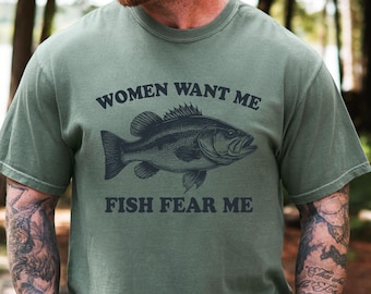 May include: A green t-shirt with a black bass fish graphic and the text "Women Want Me Fish Fear Me".