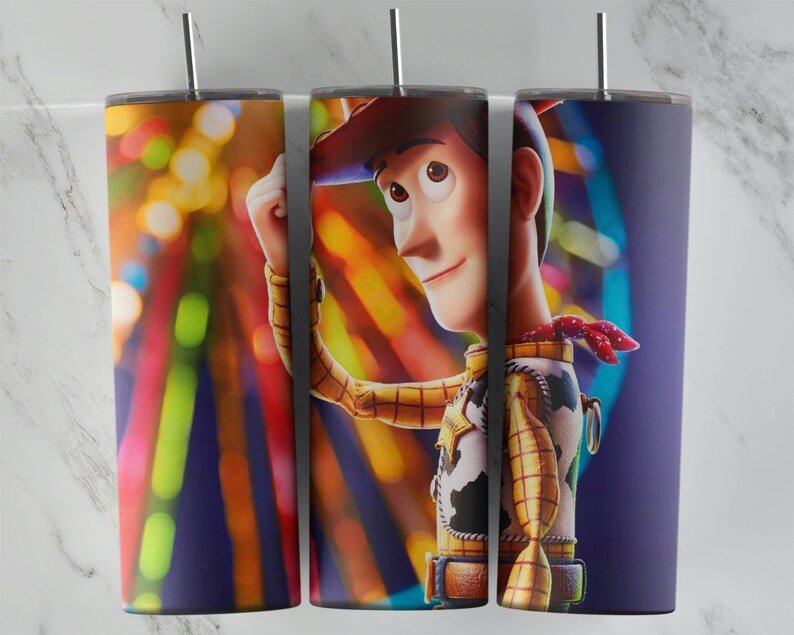 May include: A colorful tumbler with a close-up image of Woody from Toy Story. Woody is wearing his signature cowboy hat and vest. The background is a blur of colorful lights.
