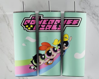 May include: Three stainless steel tumblers with a light blue background and a rainbow design. The tumblers feature the Powerpuff Girls characters, Bubbles, Buttercup, and Blossom, on a rainbow. The text "The Powerpuff Girls" is printed on the tumblers.
