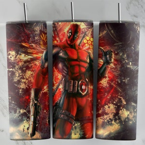 May include: Three stainless steel tumblers with a red and black Deadpool graphic. The tumblers have a red, yellow, and black abstract background.