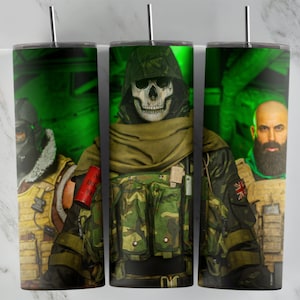May include: Three 20 oz. stainless steel tumblers with a green, black, and white camouflage pattern. The tumblers feature a skull with a gas mask, a soldier with a gas mask, and a soldier with a beard. The tumblers are perfect for everyday use.