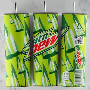 May include: A green and white tumbler with a Mountain Dew logo and a green and white geometric pattern. The tumbler has a black lid and a straw. The text on the tumbler reads "170 Calories Per Can 20 FL OZ".
