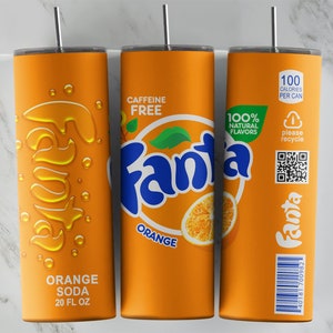 May include: Orange and blue 20 fl oz tumbler with a design inspired by a can of Fanta Orange soda. The tumbler features the Fanta logo, an orange slice, and the text "Orange Soda" and "Caffeine Free".