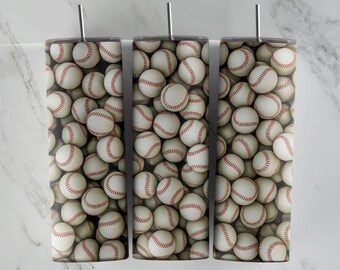 Puede incluir: Tres vasos de acero inoxidable con un patrón de béisbol. Los vasos son blancos con costuras rojas y están llenos de pelotas de béisbol.