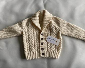 Hand knit baby Aran jacket in cream
