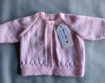 Hand knit baby cardigan with in baby pink with button