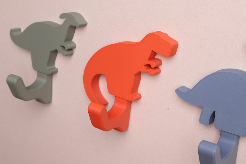 close up of dinosaur wall hooks