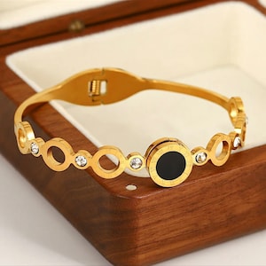Pulsera de acero inoxidable con números romanos negros