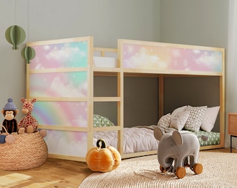 May include: A wooden bunk bed with a rainbow and cloud patterned headboard. The top bunk has a gray and white patterned pillow and a gray elephant toy on the bed. The bottom bunk has a green and white patterned pillow.