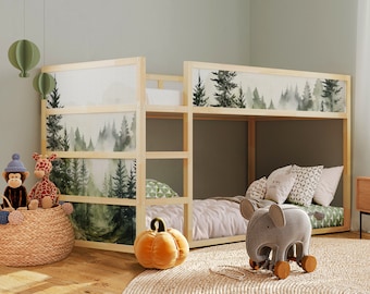 May include: A wooden bunk bed with a forest-themed wallpaper featuring a watercolor design of trees and fog. The bed has a gray mattress and a gray elephant toy on the bottom bunk.