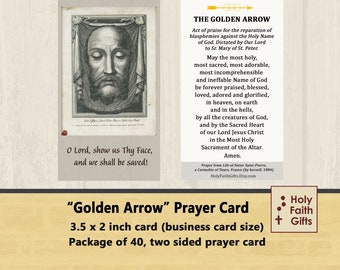 May include: A two-sided prayer card with a black and white image of Jesus' face on one side and a prayer to the Holy Name of God on the other. The card is 3.5 inches by 2 inches and is part of a package of 40 cards. The text on the card reads "Golden Arrow" Prayer Card.  The card is printed on white cardstock and has a brown woodgrain background.