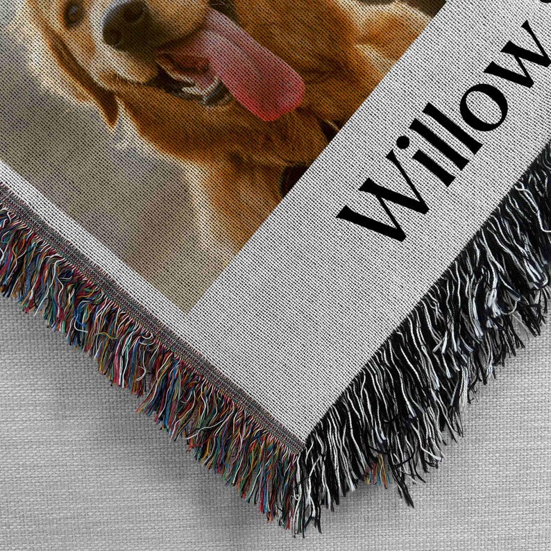 May include: A woven throw blanket with a photo of a golden retriever dog with its tongue sticking out. The blanket has a fringe border and the name "Willow" is printed on the bottom right corner.