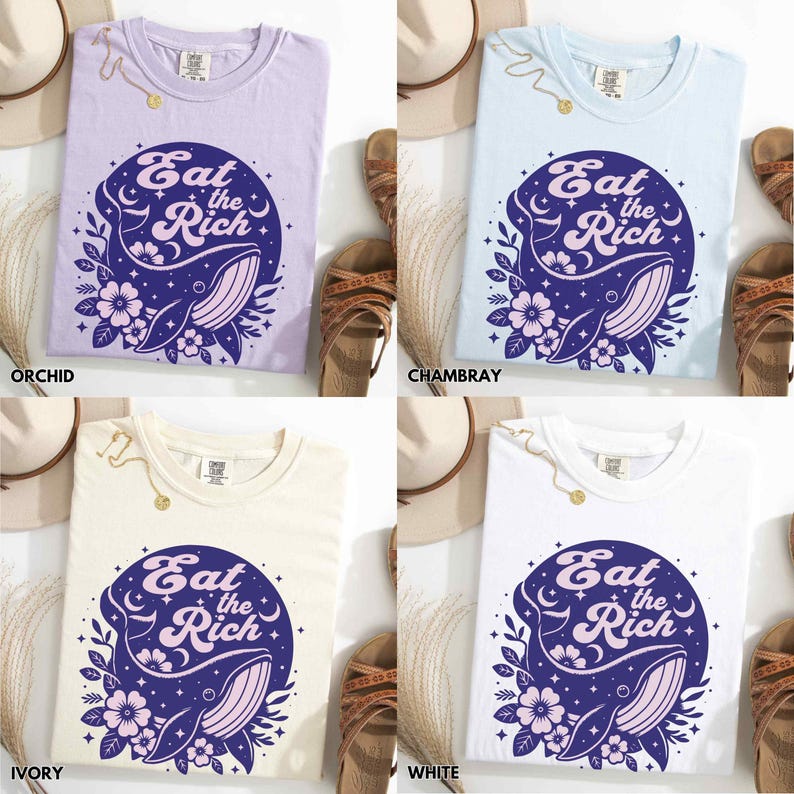 May include: Four t-shirts in different colours, each featuring the same graphic design. The graphic is a circle with a whale, flowers, and the text "Eat the Rich". The t-shirts are in orchid, ivory, white, and Chambray.