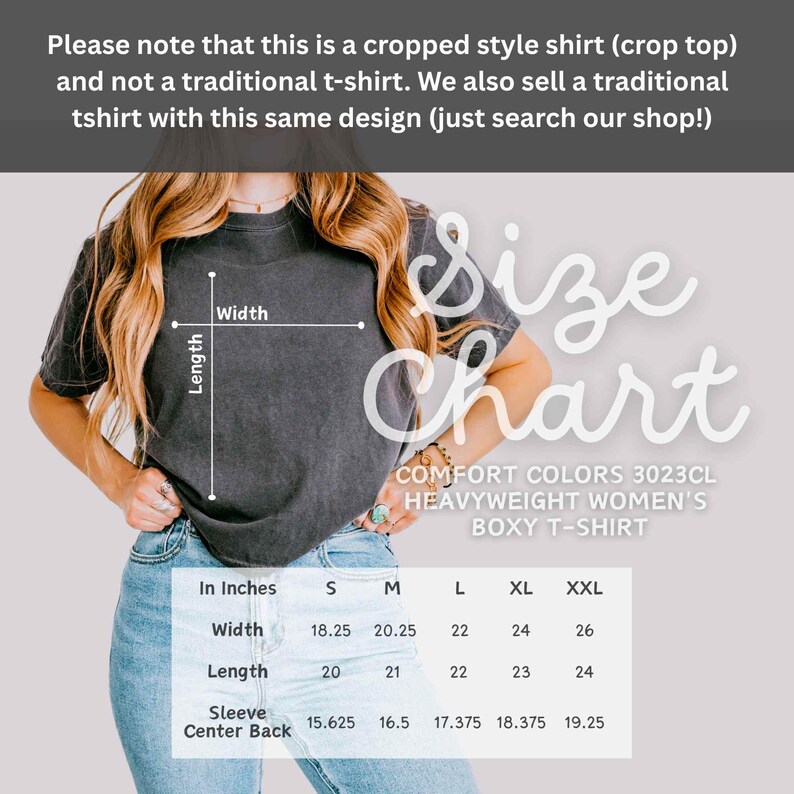 May include: A dark gray Comfort Colors heavyweight boxy t-shirt with a size chart. The chart provides measurements in inches for width, length, and sleeve center back for sizes S, M, L, XL, and XXL. The shirt is a cropped style.