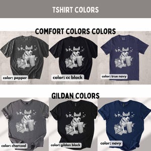 May include: A variety of t-shirts in different colors, including pepper, cc black, true navy, charcoal, gildan black, and navy. Each shirt features a graphic of a dog wearing sunglasses and holding a drink. The text "TSHIRT COLORS" and "COMFORT COLORS COLORS" and "GILDAN COLORS" are displayed.