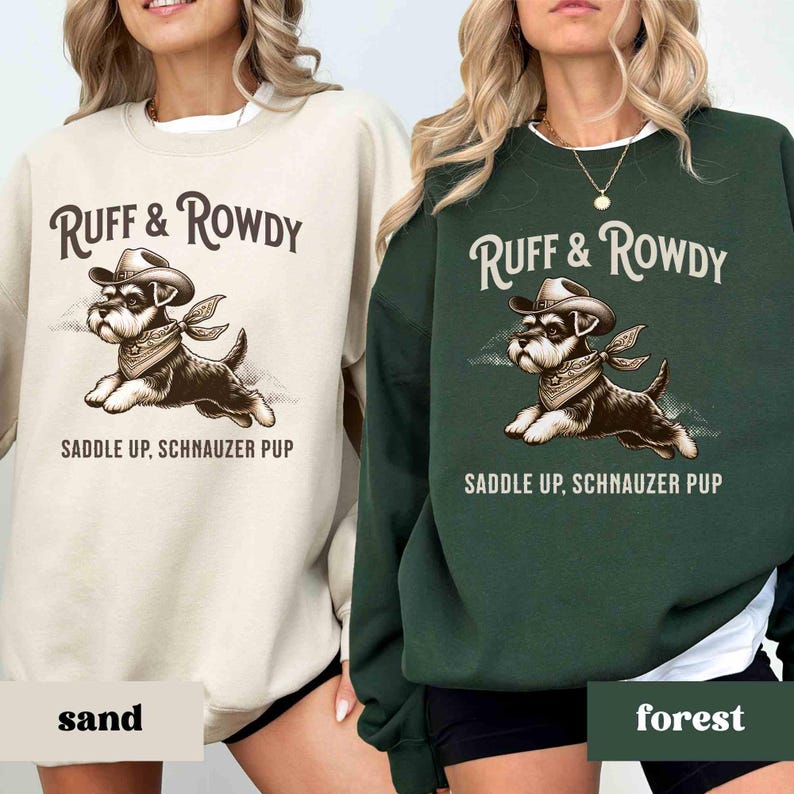 May include: Two sweatshirts with a cartoon image of a dog wearing a cowboy hat and bandana. The text on the sweatshirts reads "Ruff & Rowdy" and "Saddle Up, Schnauzer Pup". One sweatshirt is sand colored and the other is forest green.