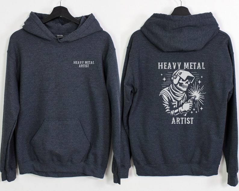 May include: A dark gray hooded sweatshirt with the text "Heavy Metal Artist" on the front and a graphic of a skeleton wearing a welding mask and holding a welding torch on the back.