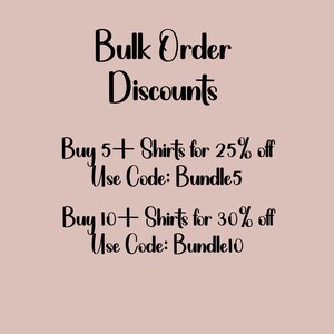 May include: A promotional graphic on a light pink background. The text reads "Bulk Order Discounts." It offers 25% off for buying 5+ shirts with code Bundle5, and 30% off for 10+ shirts with code Bundle10.
