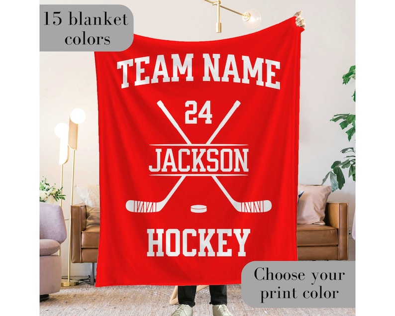 Custom Ice Hockey Blanket with the team name and hockey written at the top and bottom respectively in varsity font - along with the player name and number arranged within two crossed hockey sticks in the center