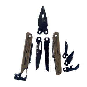 May include: A multi-tool with various components, including pliers, a saw, and a knife. The tool has a tan and black color scheme, with the text "LEATHERMAN SIGNAL" visible on one side. The tools are arranged against a white background.