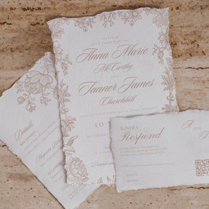 May include: Wedding invitation suite with a floral design. The main invitation features the names "Anna Marie McCarthy" and "Tanner James Churchill" in elegant script. The RSVP card includes a QR code for easy response.