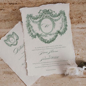 elegant green botanical wedding invitation printable template. Invitations laying on a wood background. Cottage Core wedding invites