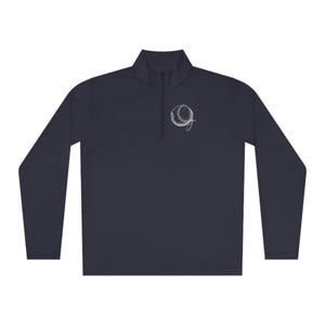 May include: A navy blue long-sleeved performance shirt with a white baseball graphic on the left chest.