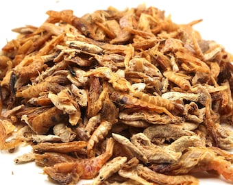 May include: A pile of dried shrimp, a popular ingredient in Asian cuisine, is shown against a white background.
