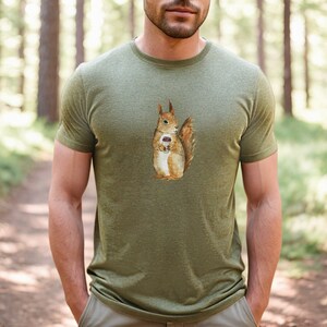 Heather Olive colored tshirt featuring a fuzzy squirrel drinking a hot coffee.