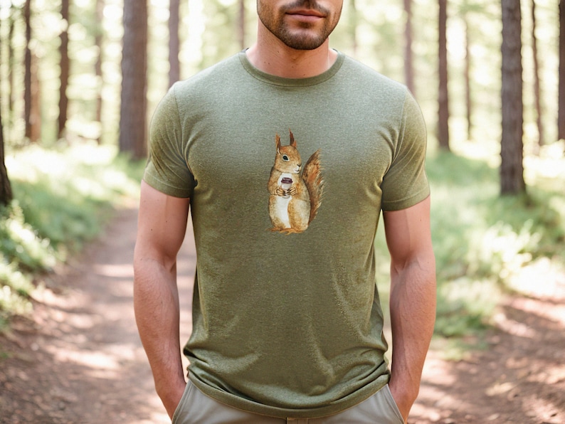 Heather Olive colored tshirt featuring a fuzzy squirrel drinking a hot coffee.