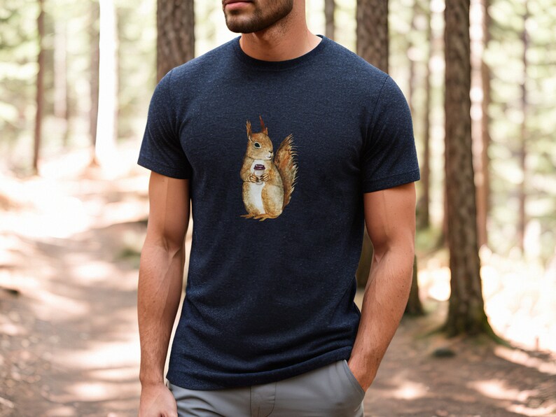 Heather Navy colored tshirt featuring a fuzzy squirrel drinking a hot coffee.
