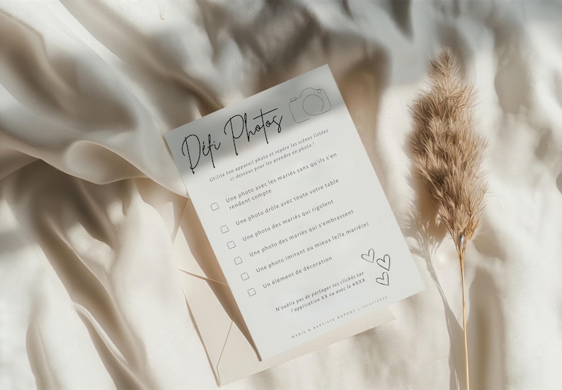 May include: A white card with black text that reads 'Difc Photos' and has a checklist of photo challenges for a wedding. The challenges include taking photos of the couple, the guests, and the wedding decorations. The card also has a small camera icon and two hearts.