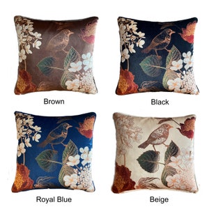 May include: Four decorative throw pillows with a floral and bird design. The pillows are in brown, black, royal blue, and beige.