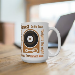 Neil Young tribute Cup ,album titles  vintage design record player Harvest moon , tonights the night and others will please the Neil fans