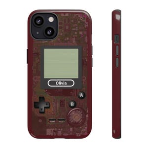 Retro Game Boy inspired phone case for iPhone, Samsung Galaxy, and Google Pixel. Vintage handheld gaming design perfect for Nintendo fans, gamers, and lovers of 80s and 90s nostalgia. A fun video game phone cover and unique gift for him, for teens, or for retro gaming collectors. Old-school look with a modern twist. Available in 8 colors: black, purple, green, yellow, white, brown, and red.