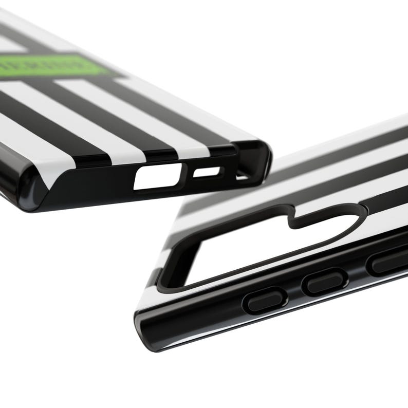 Close-up of custom name iPhone, Samsung Galaxy, and Google Pixel phone case inspired by Beetlejuice and Wednesday Addams. Black and white striped design with gothic, alternative, and spooky aesthetic. Perfect personalized gift for Halloween, Christmas, or fans of dark fashion and Tim Burton style.