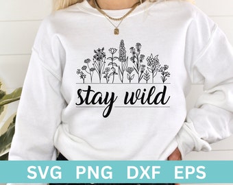 May include: A white sweatshirt with a black line drawing of a row of flowers and the text "stay wild".