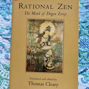 May include: A hardcover book titled "Rational Zen: The Mind of Dogen Zenji" by Thomas Cleary. The cover is tan with black text and a colorful illustration. The book is part of the Shambhala Dragon Editions series.